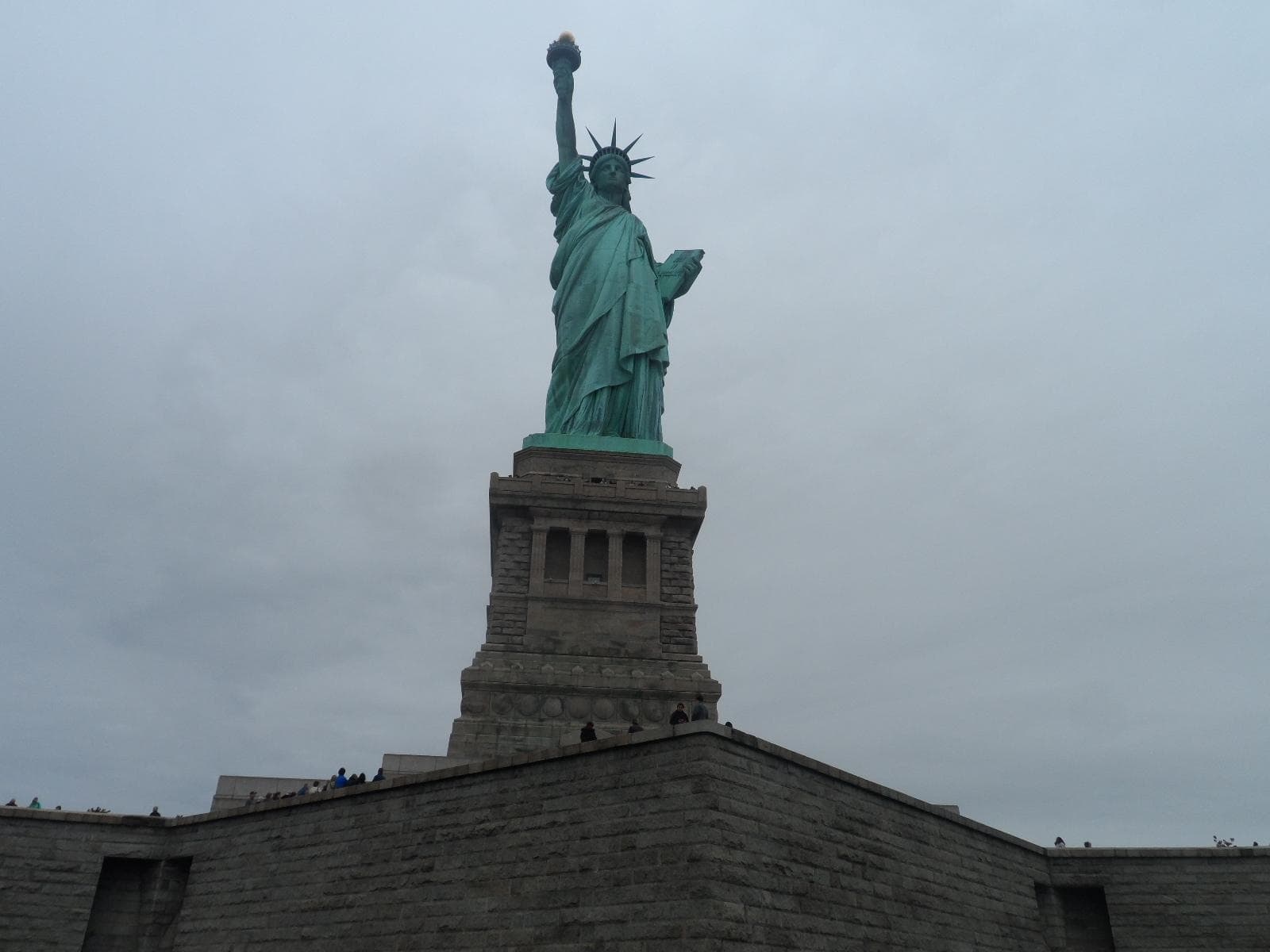 Standing in front of the Statue of Liberty; photo credit: Katherine Michel