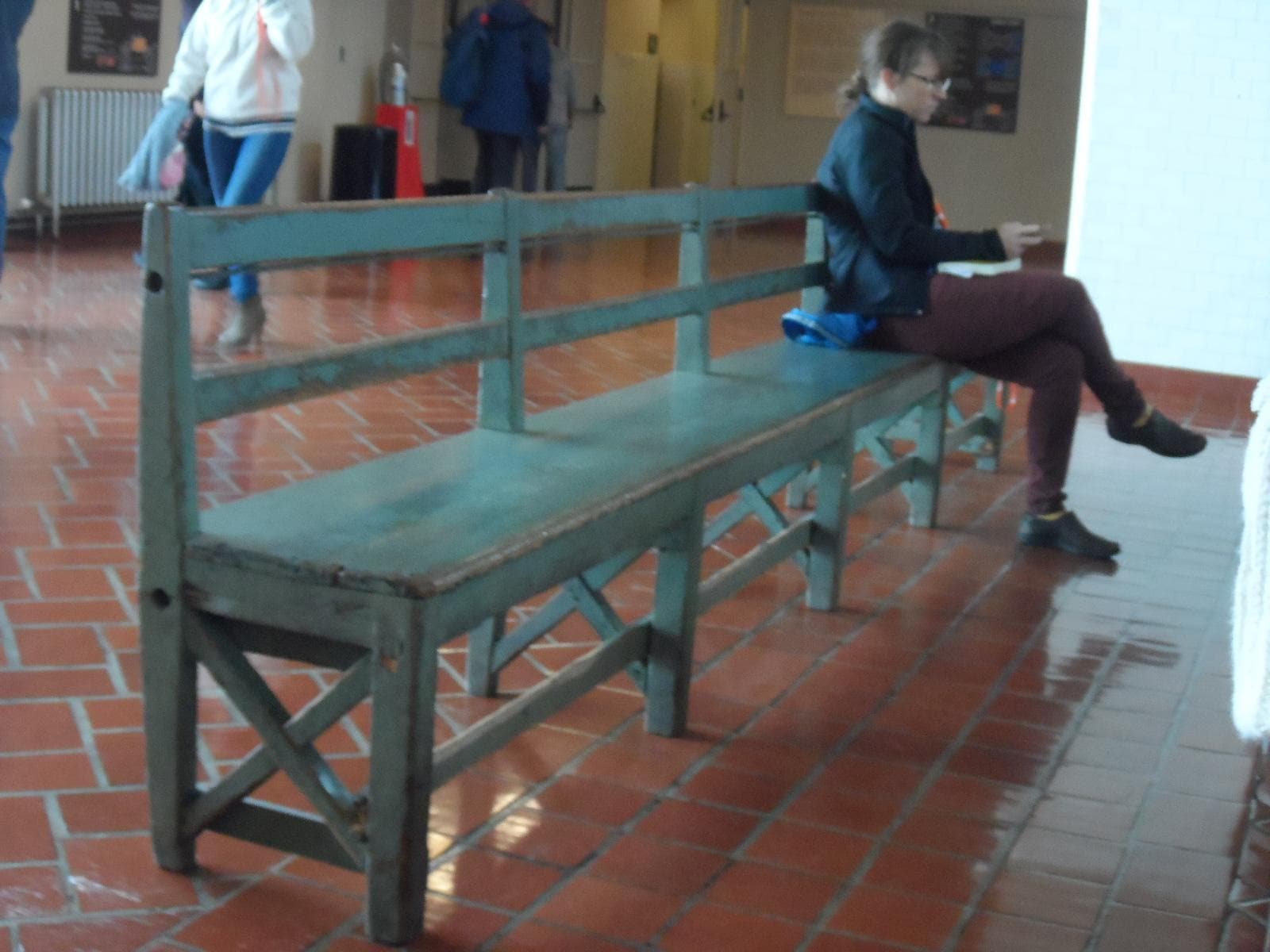 One of the green benches used when the building was in service; photo credit: Katherine Michel